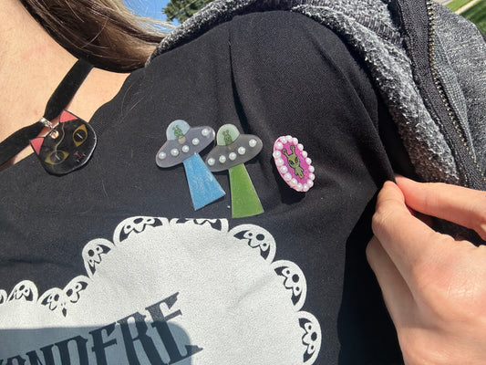 pearl accented spaceship brooch