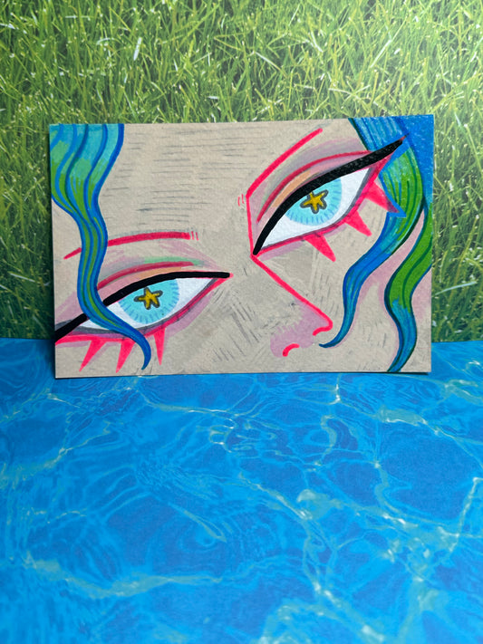 Abstract artwork with colorful eye-like shapes on a textured surface