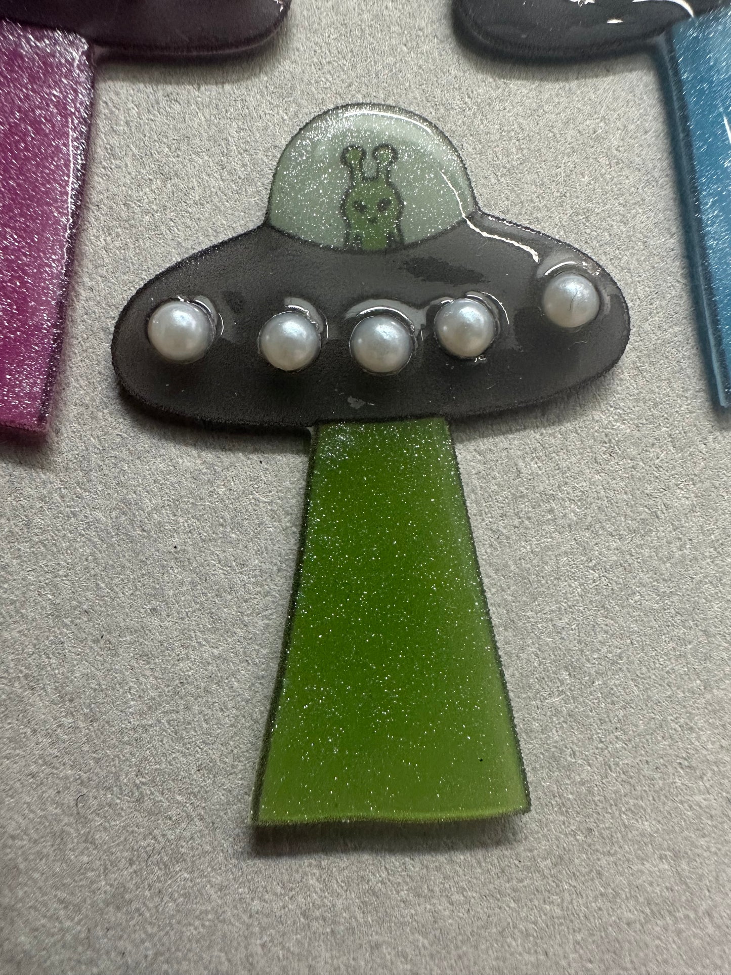 pearl accented spaceship brooch