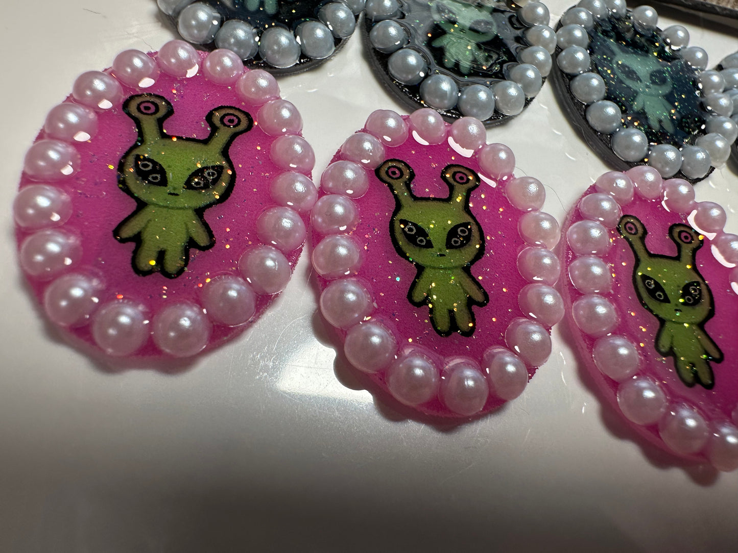 pearl accented alien brooch