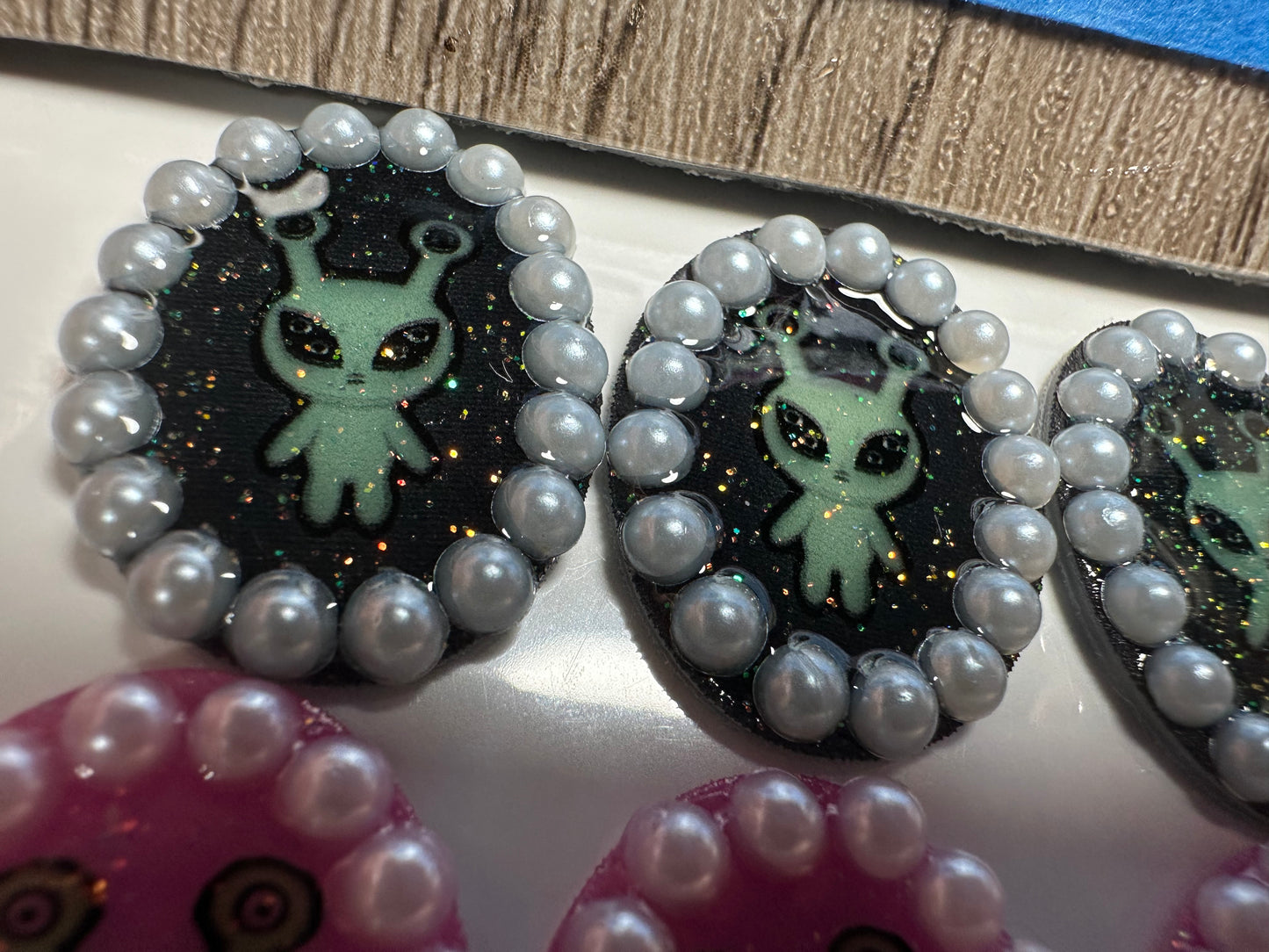 pearl accented alien brooch